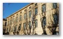 Shadows of bare trees at the market place in Aix-en-Provence, with a December sunshine